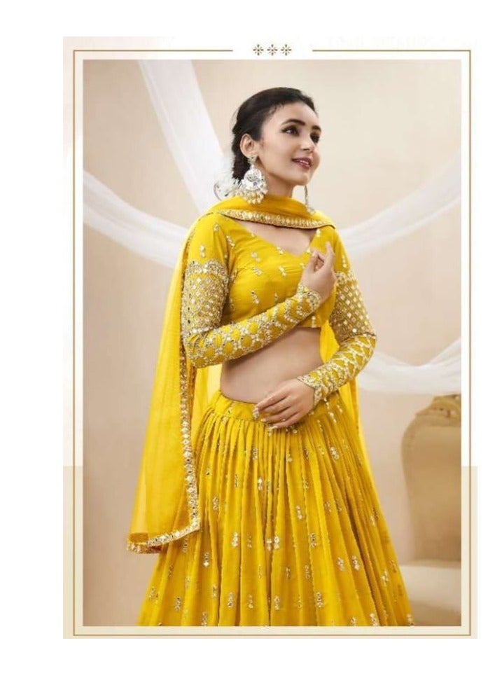 White lehenga with embroidered blouse and net dupatta