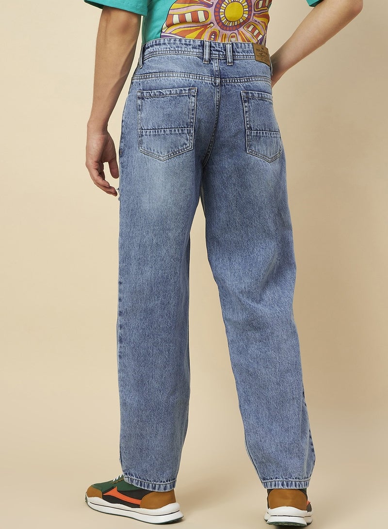 Loose Fit Mid Blue Jeans for Men with Mild Distressing