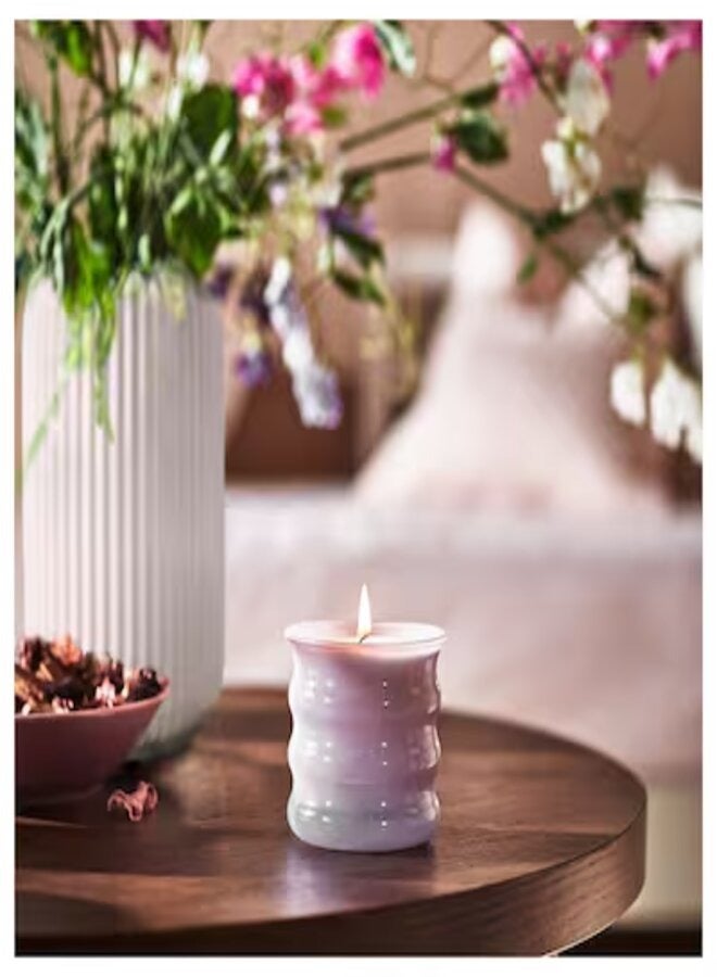 Scented candle in glass Sweet pea purple