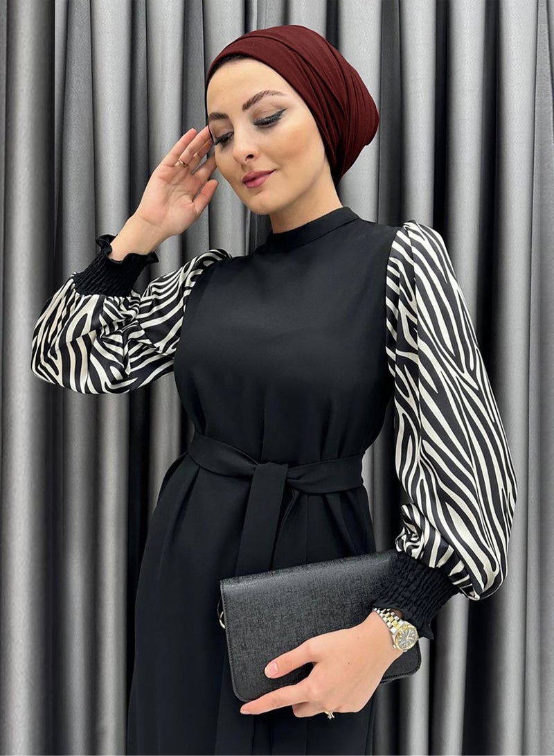 Elegant Middle Eastern-Inspired Black Dress with Black and White Striped Sleeves - Perfect for Professional Women