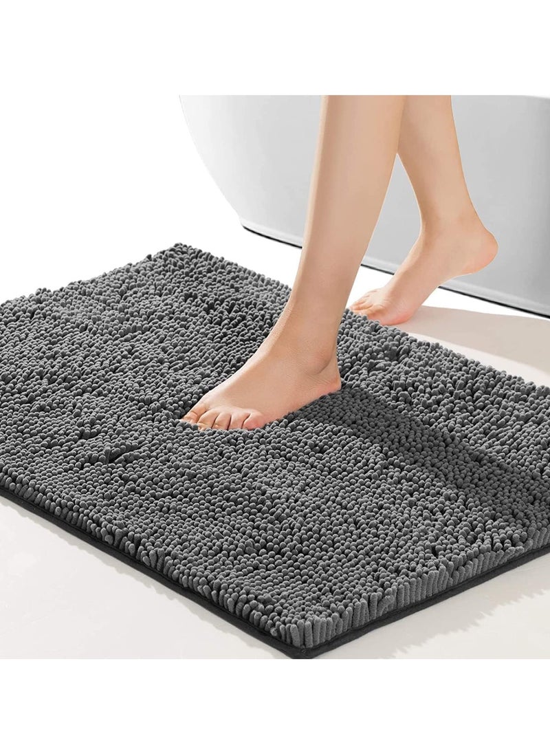 Bathroom Rug (80x50 cm): A non-slip bath mat with a soft, cozy, and plush shaggy design. Durable and thick, it provides comfort and long-lasting quality. Quick-drying and versatile, it's perfect for use in bathrooms, bathtubs, as a doormat, during rain showers, or under the sink.