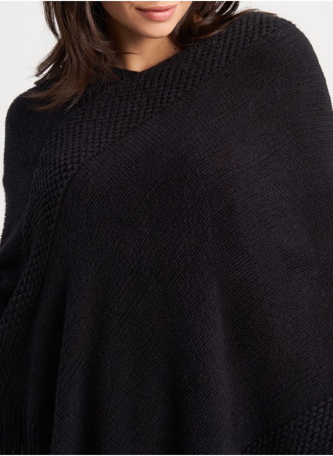 Chic Black Knitted Poncho with Fringes - Modern and Versatile