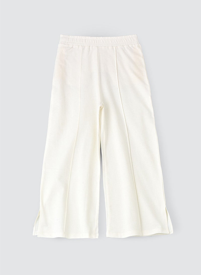 Solid knit pant with cut at bottom
