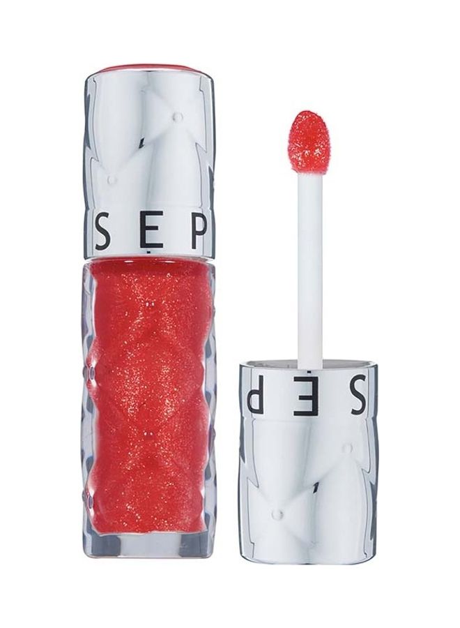 Outrageous plump effect gloss 10. Coral Flash
