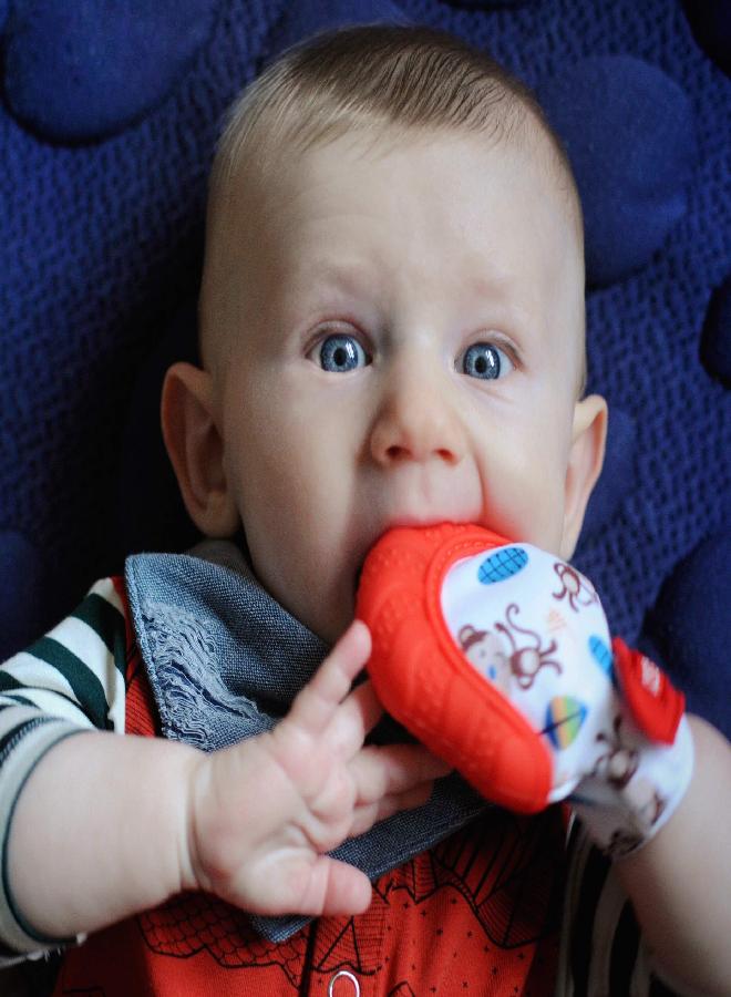 Nuby Soothing Teething Mitten with Hygienic Travel Bag, Red Monkey, 1 Count (Pack of 1)