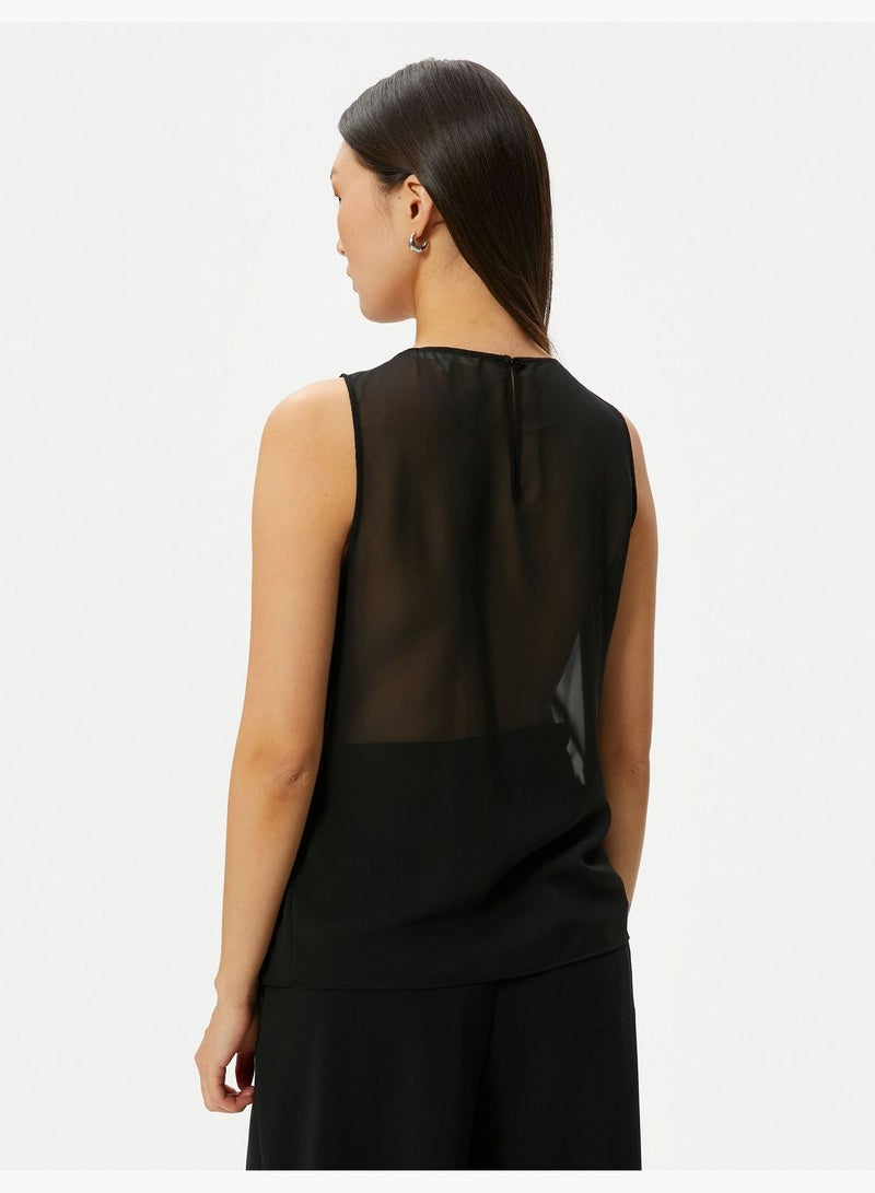 Asymmetric Cut Sleeveless Blouse