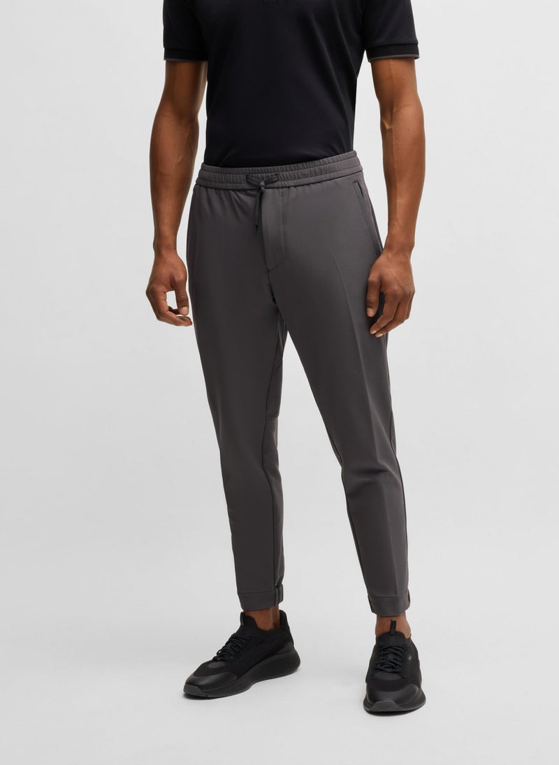 Tapered-fit trousers in water-repellent stretch fabric