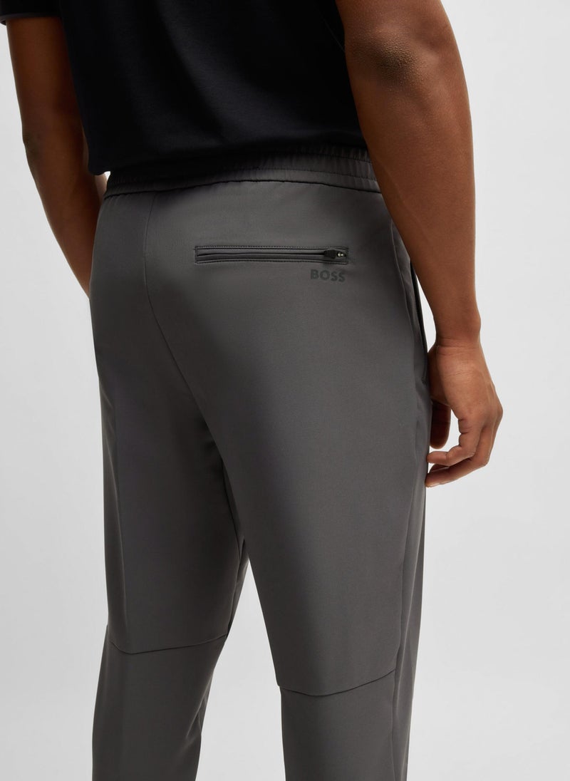 Tapered-fit trousers in water-repellent stretch fabric