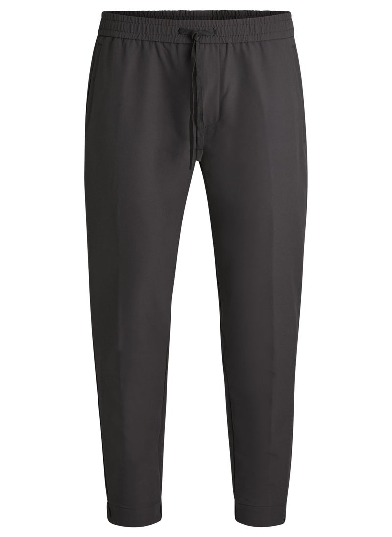 Tapered-fit trousers in water-repellent stretch fabric