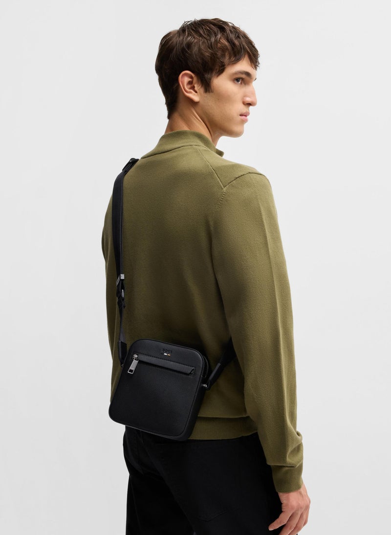 Grained faux-leather reporter bag with signature trims