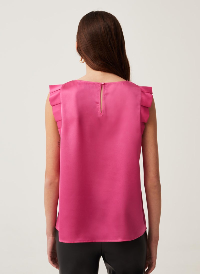 Sleeveless blouse with ruffles