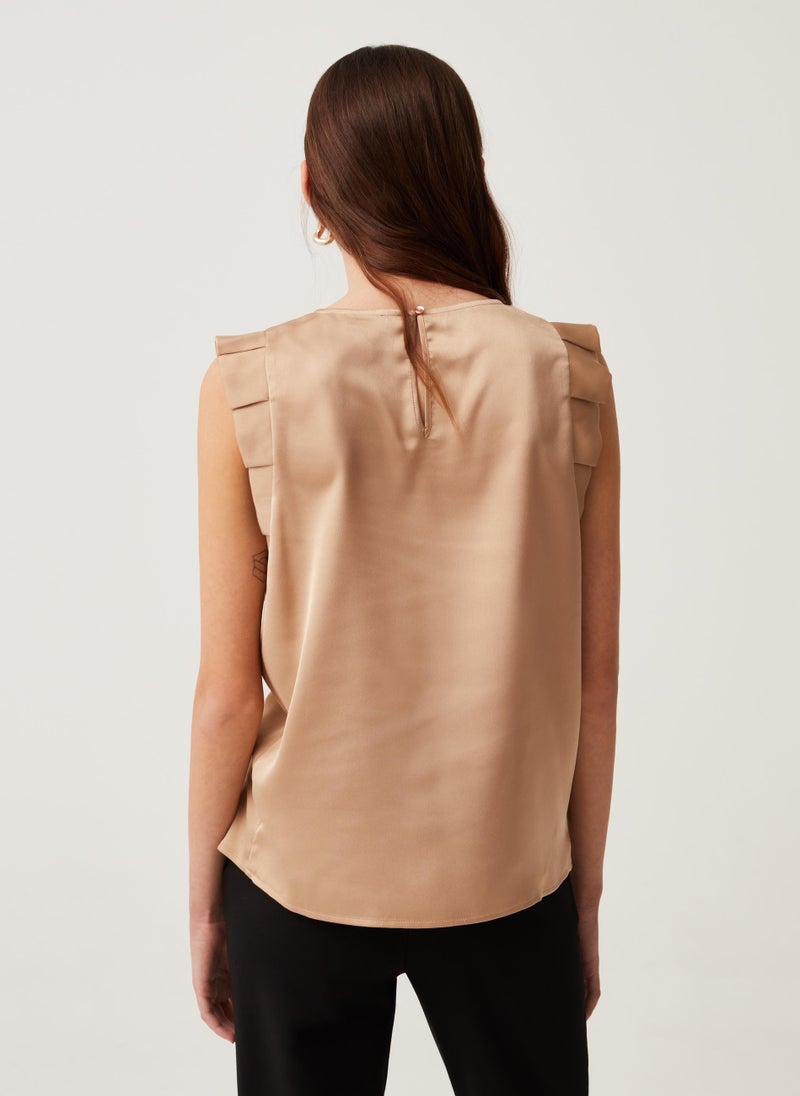 Sleeveless blouse with ruffles