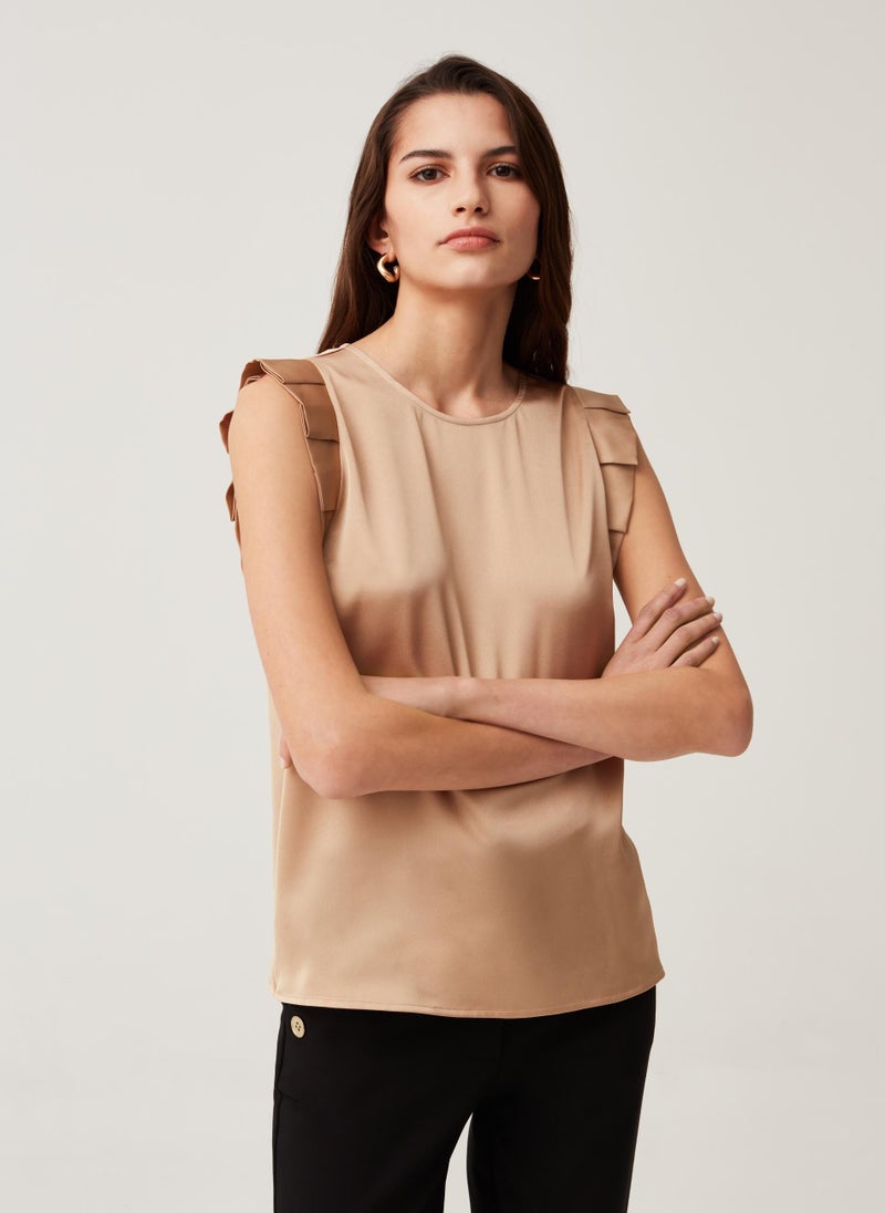 Sleeveless blouse with ruffles