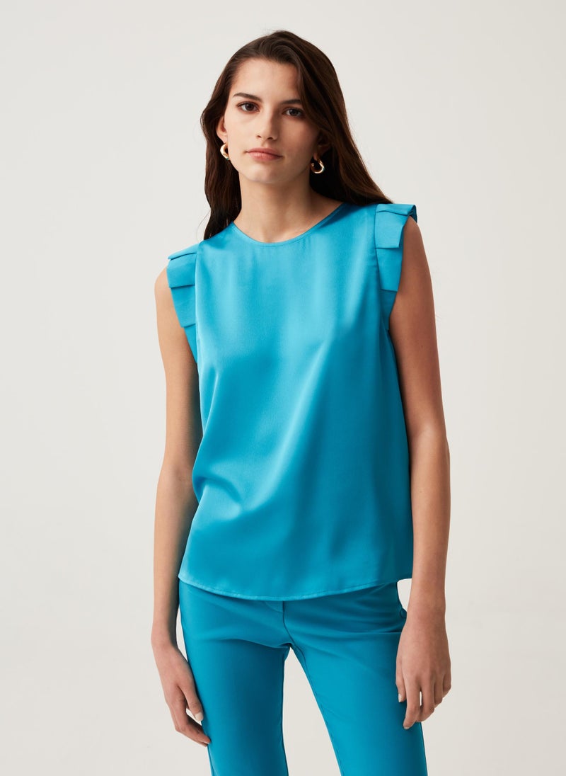 Sleeveless blouse with ruffles