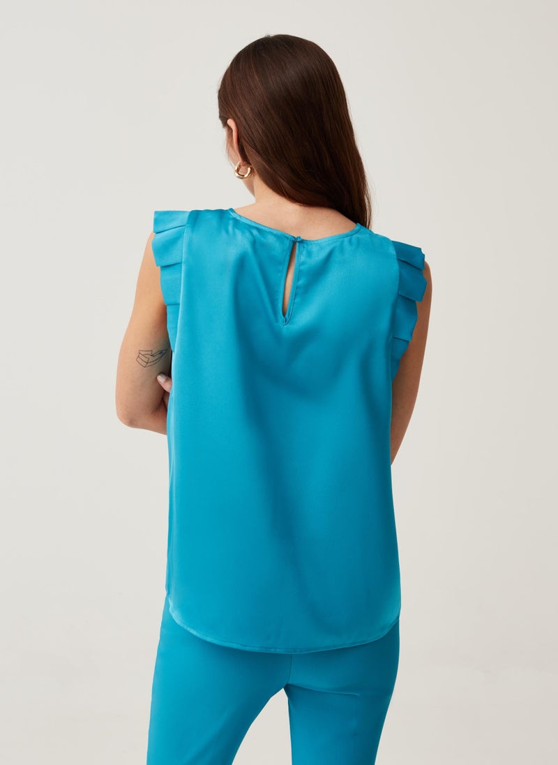 Sleeveless blouse with ruffles