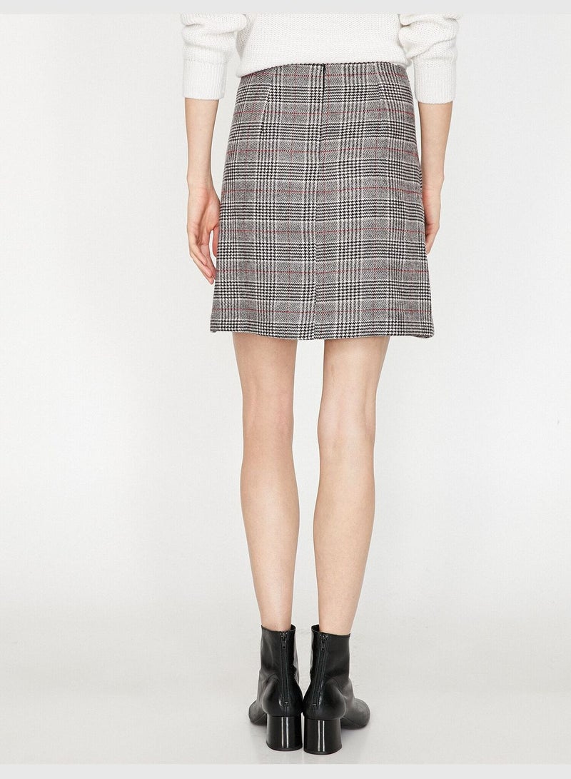 High-rise plaid mini skirt.