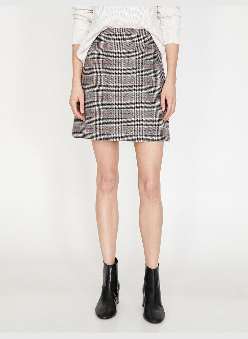 High-rise plaid mini skirt.