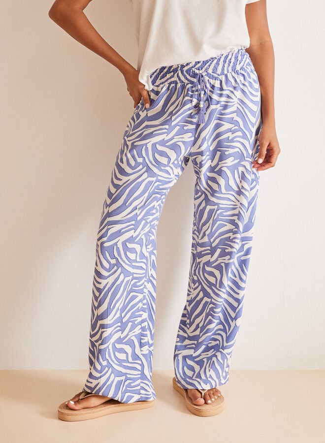 Blue zebra print trousers