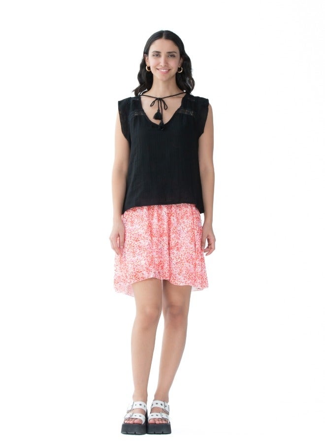 A playful short skirt with a bright floral pattern, adding a pop of color to your wardrobe.