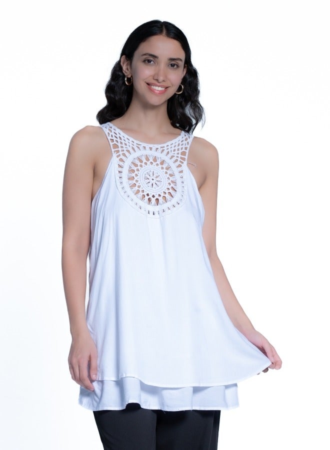 Beautiful sleeveless top with intricate crochet detailing, perfect for summer days.