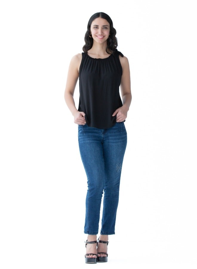 Versatile black sleeveless top with a gathered neckline, perfect for layering or standalone use.