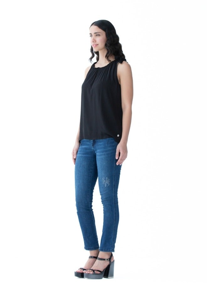 Versatile black sleeveless top with a gathered neckline, perfect for layering or standalone use.