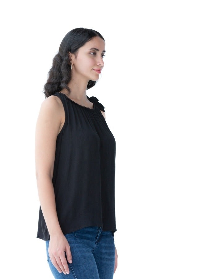 Versatile black sleeveless top with a gathered neckline, perfect for layering or standalone use.