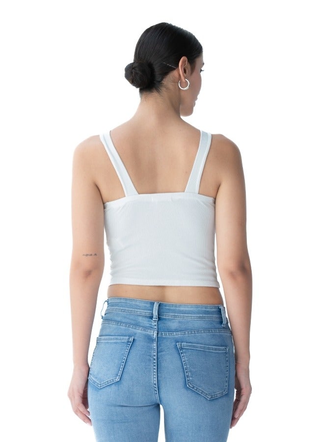 Trendy white crop top with a unique cross-back design, perfect for summer wear.