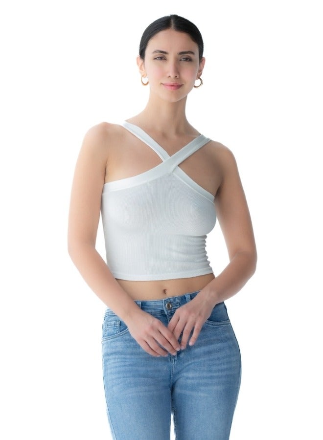 Trendy white crop top with a unique cross-back design, perfect for summer wear.