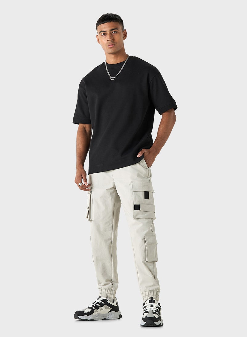 Solid Relaxed Fit Cargo Pants with Drawstring Clos