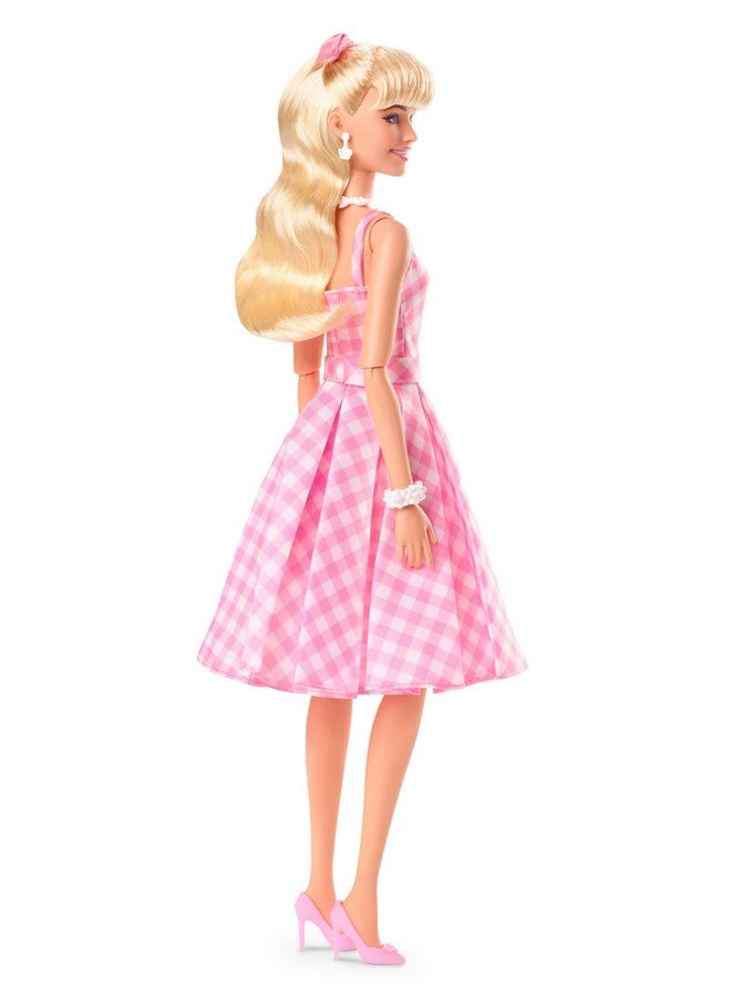 The Movie Doll Wearing Pink And White Gingham Dress With Daisy Chain Necklace