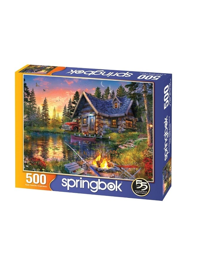 Springbok Sun Kissed Cabin 500 Piece Jigsaw Puzzle for Adults Features a Fishing Cabin by The Lake in a Colorful Illustration