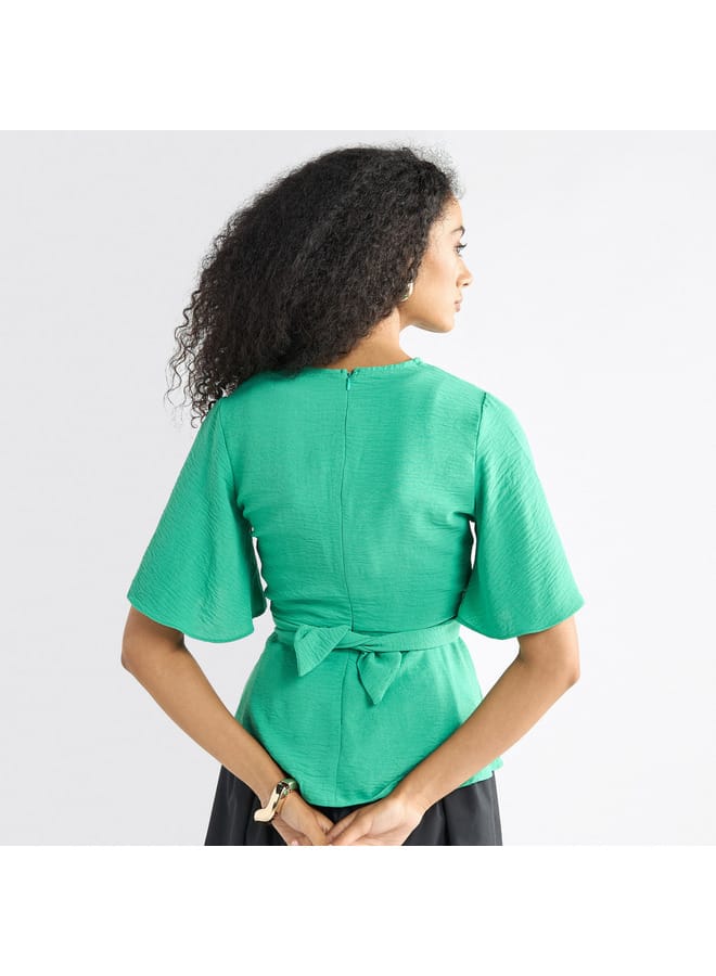 Solid V-neck Top with Flutter Sleeves and Knot Detail