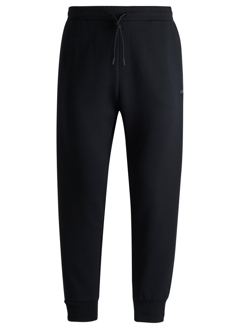 Stretch-cotton tracksuit bottoms with logo print