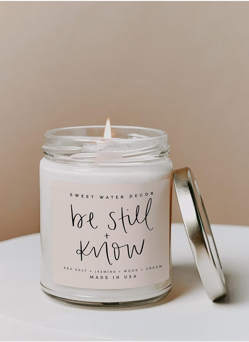 Sweet Water Decor, Be Still and Know, Sea Salt, Jasmine, Cream, and Wood Scented Soy Wax Candle for Home | 9oz Clear Jar, 40 Hour Burn Time, Made in the USA