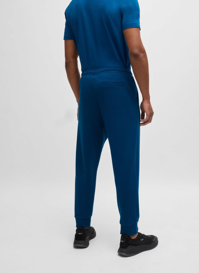 Stretch-cotton tracksuit bottoms with logo print