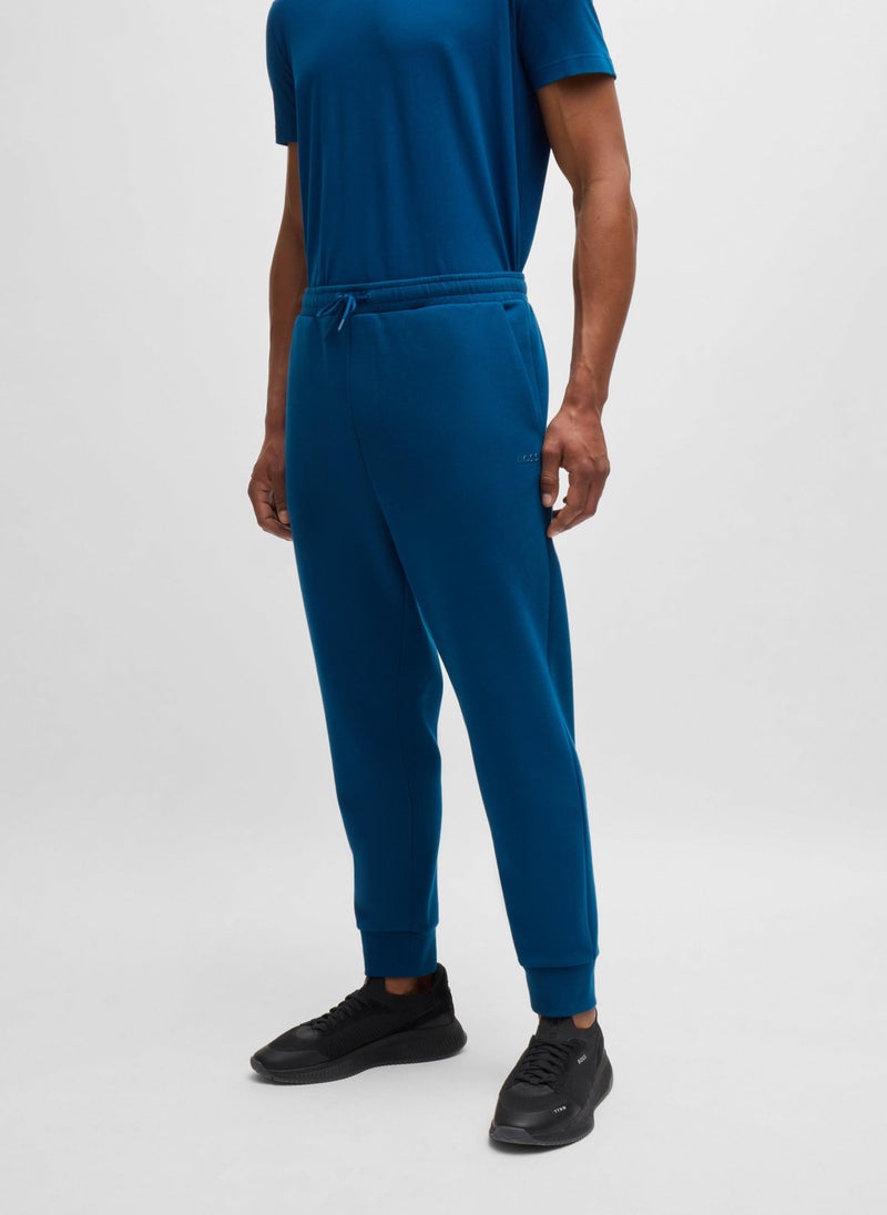 Stretch-cotton tracksuit bottoms with logo print