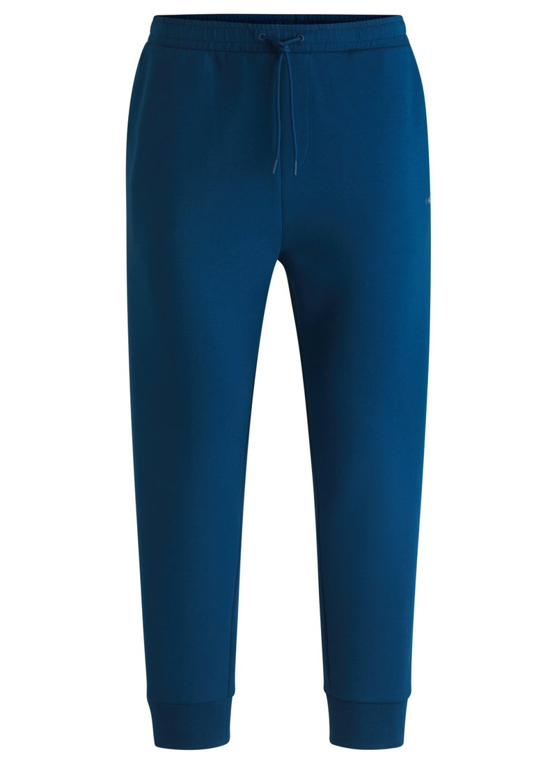 Stretch-cotton tracksuit bottoms with logo print