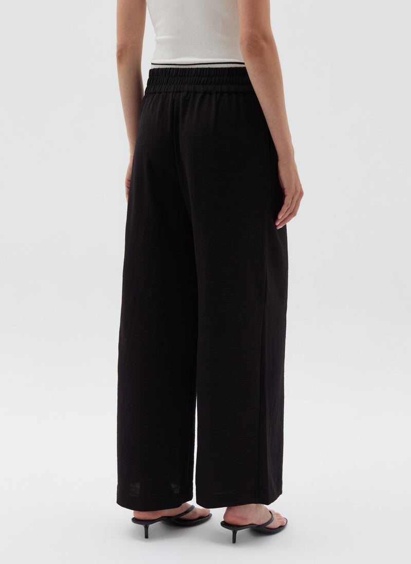 Crinkle-effect fluid trousers