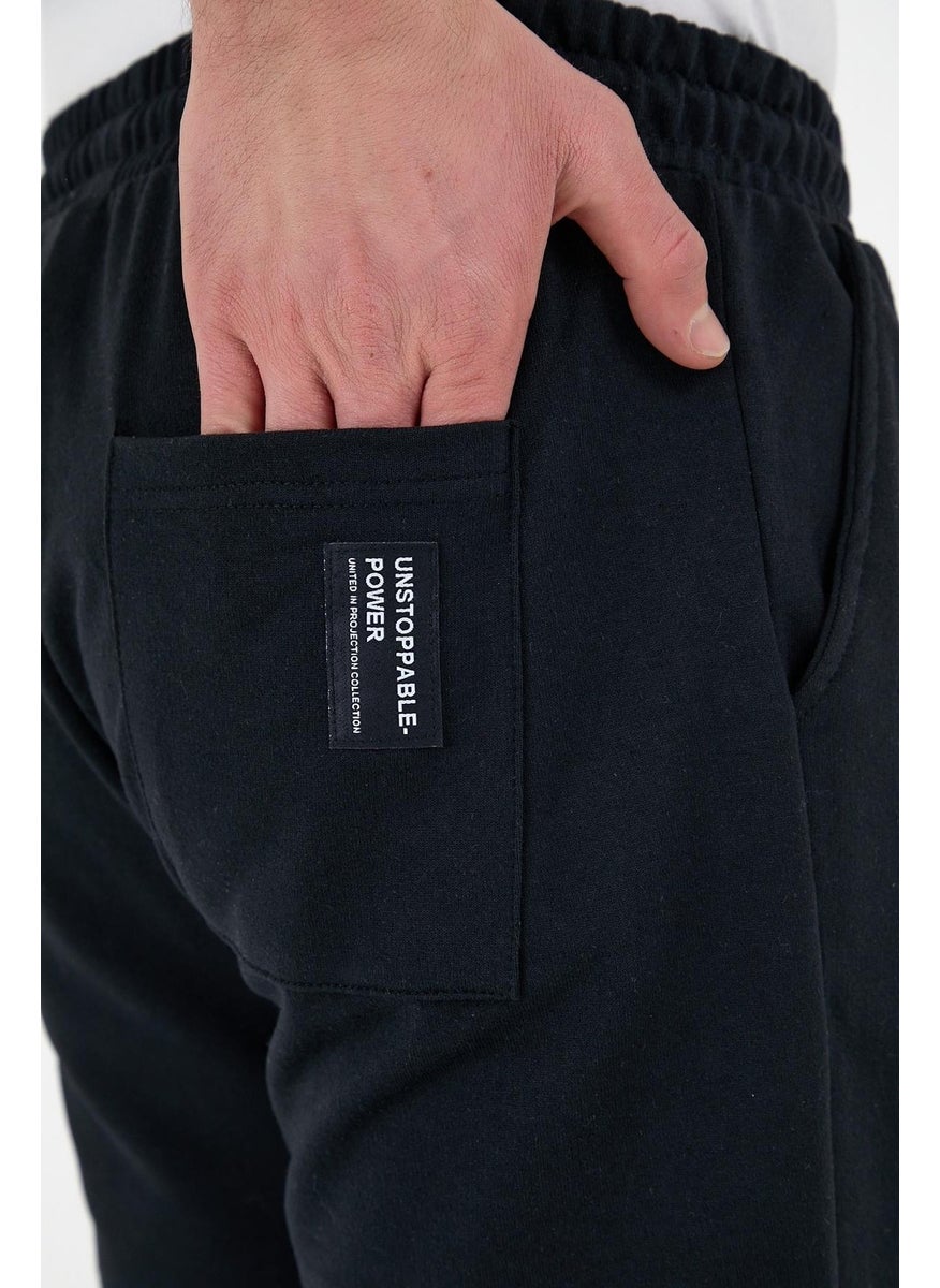 Black Men's Sweatpants with Labeled Back and Side Pockets Regular Fit Elastic Legs.