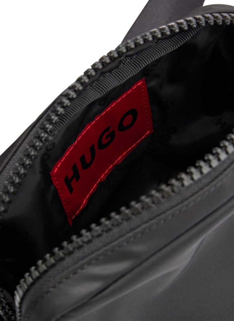 Reporter bag with red logo patch