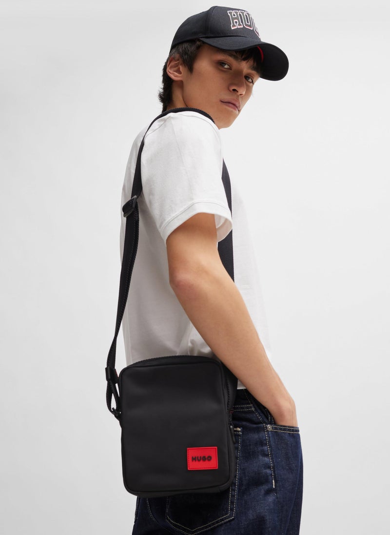 Reporter bag with red logo patch