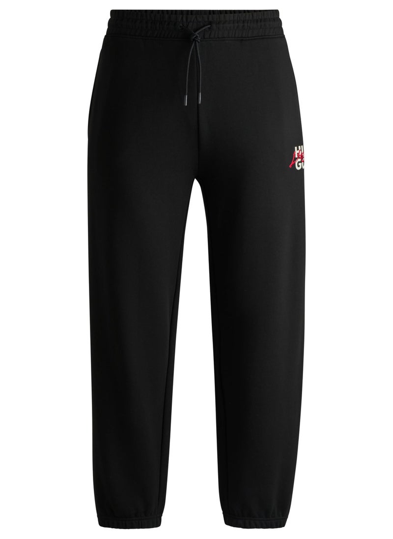 Cotton-terry tracksuit bottoms with double logo