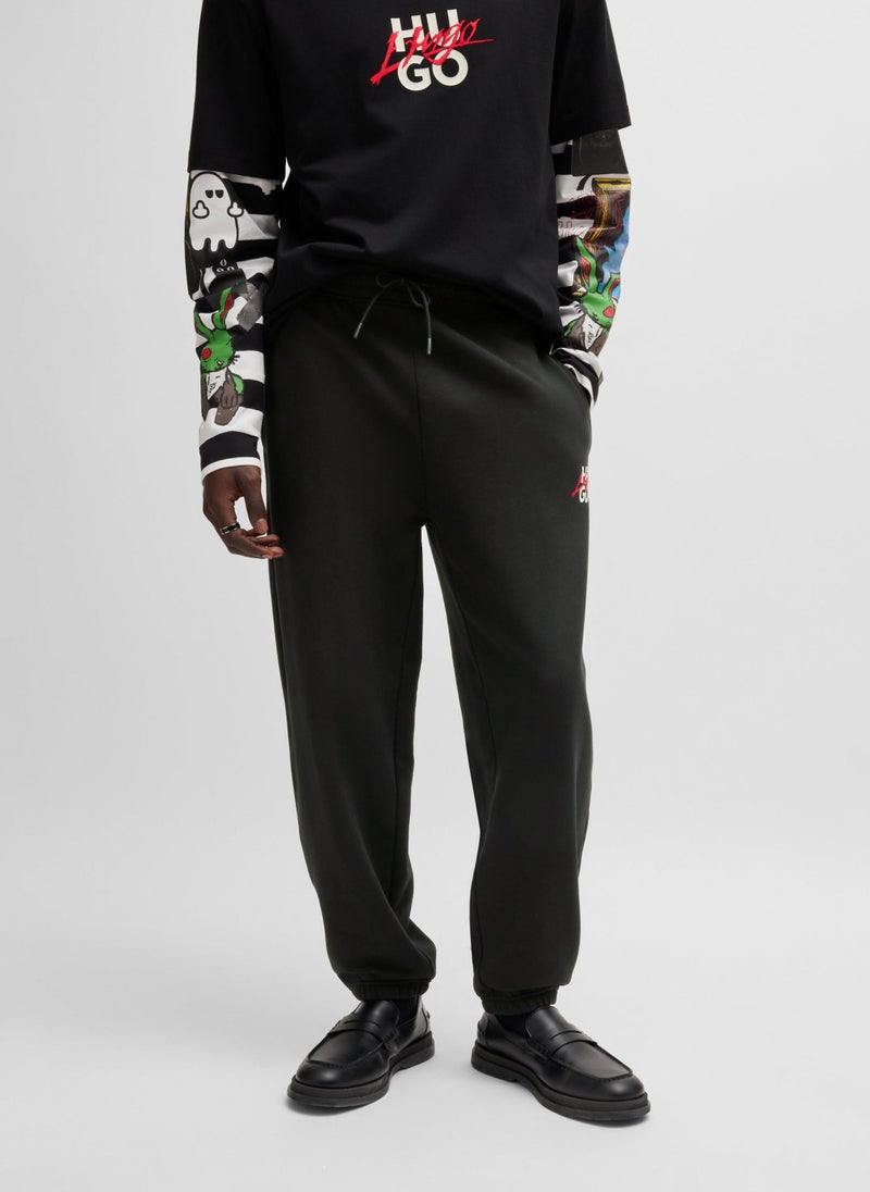 Cotton-terry tracksuit bottoms with double logo