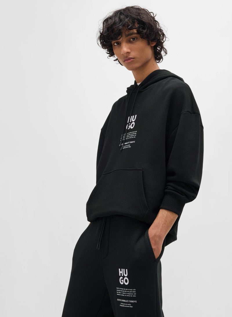 Relaxed-fit tracksuit bottoms with logo and slogans