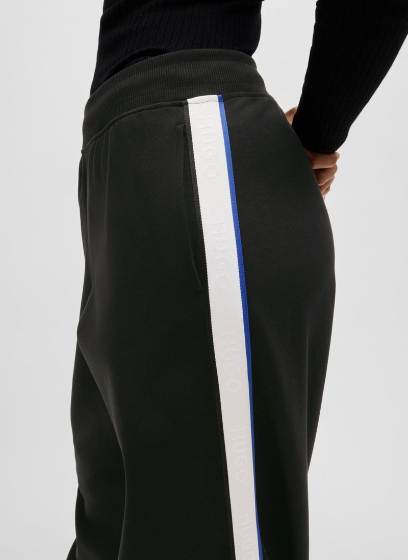 Wide-leg stretch-cotton tracksuit bottoms with logo tape