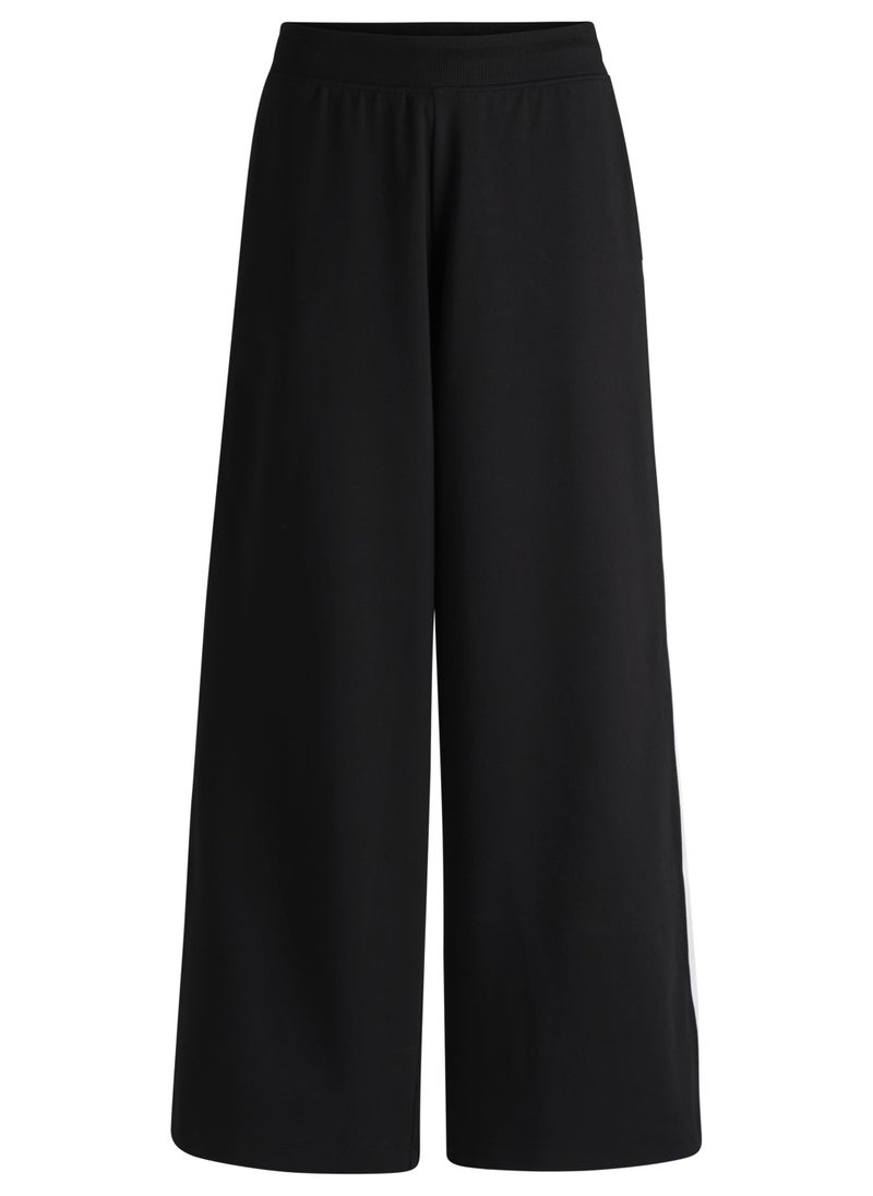 Wide-leg stretch-cotton tracksuit bottoms with logo tape