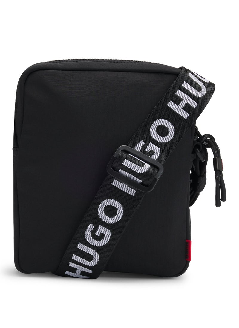 Reporter bag with branded adjustable strap and zip closure