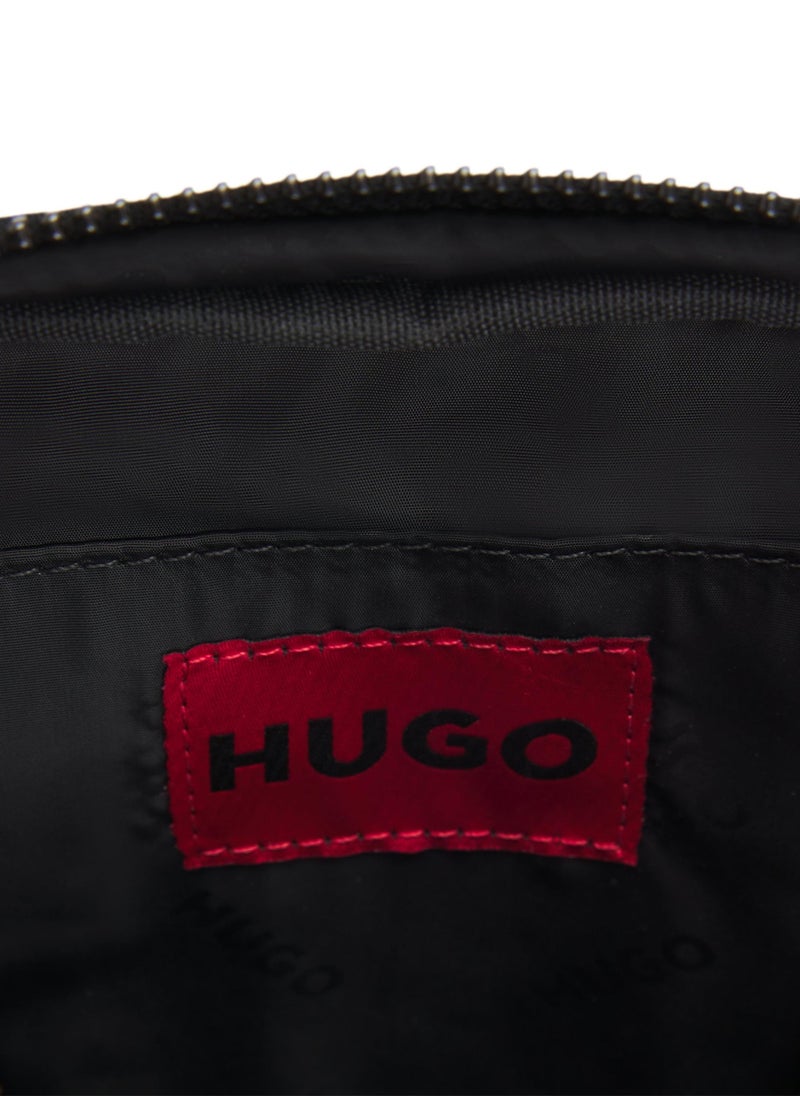 Reporter bag with branded adjustable strap and zip closure