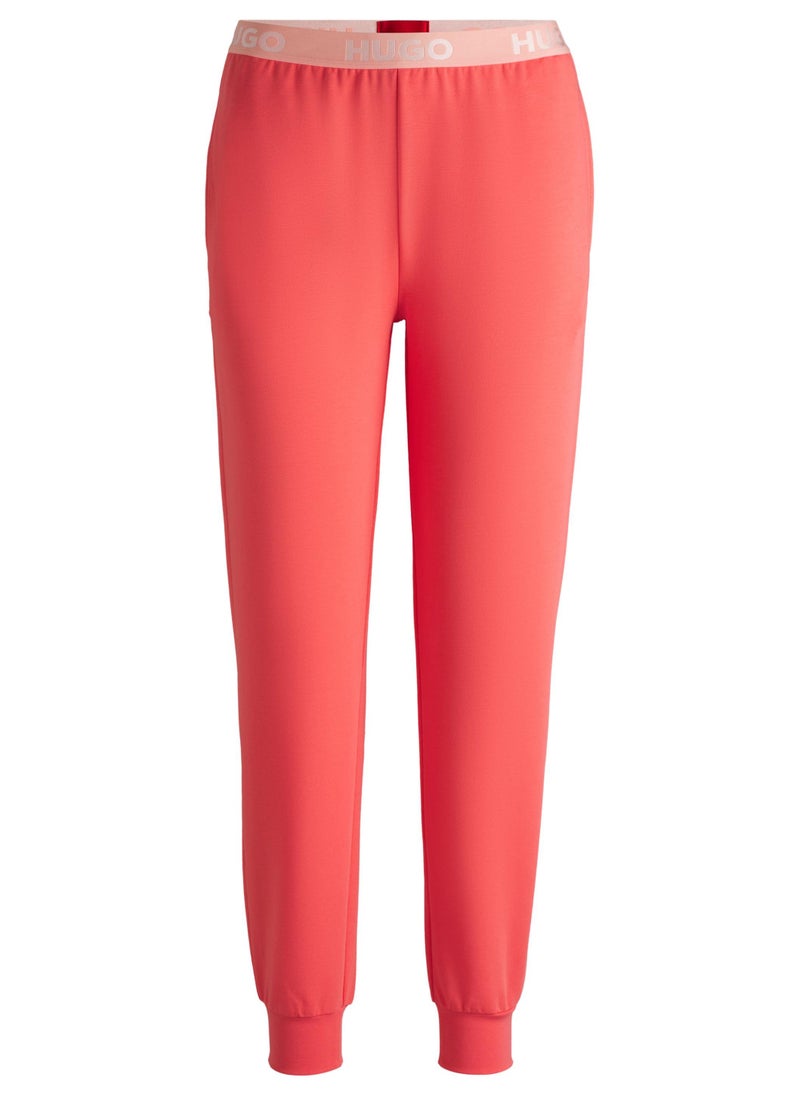Cotton-blend tracksuit bottoms with logo waistband